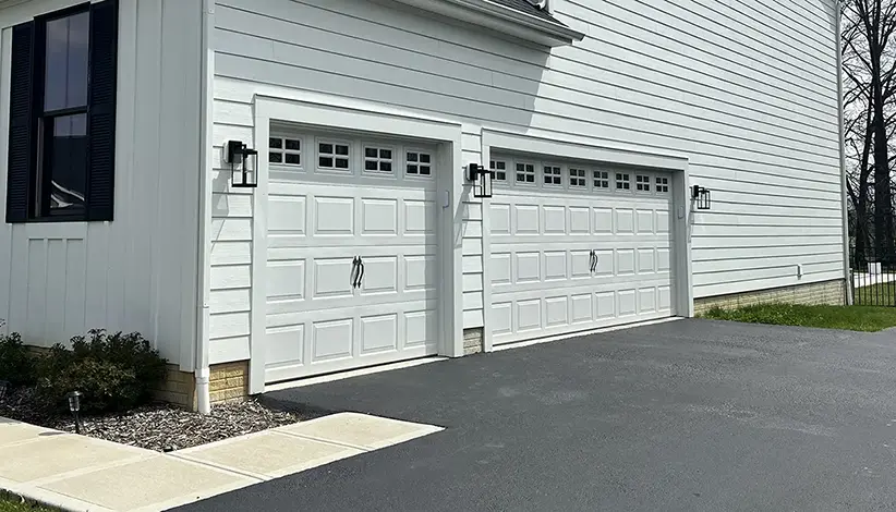 Before Photo of classic white garage doors