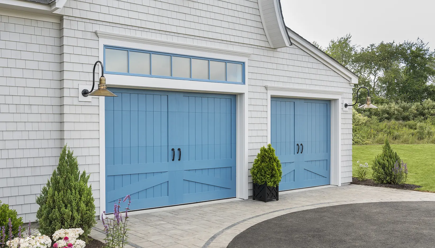 Canyon Ridge 5-Layer garage door in custom blue color