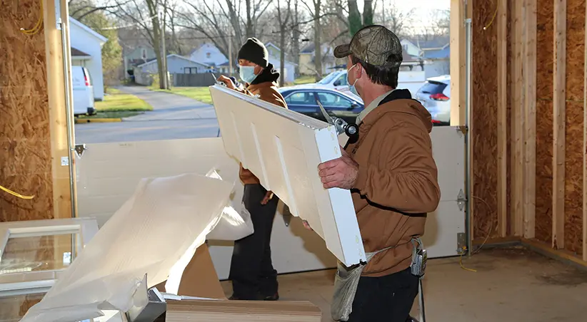 Installers from County Door with the Coachman Garage Door