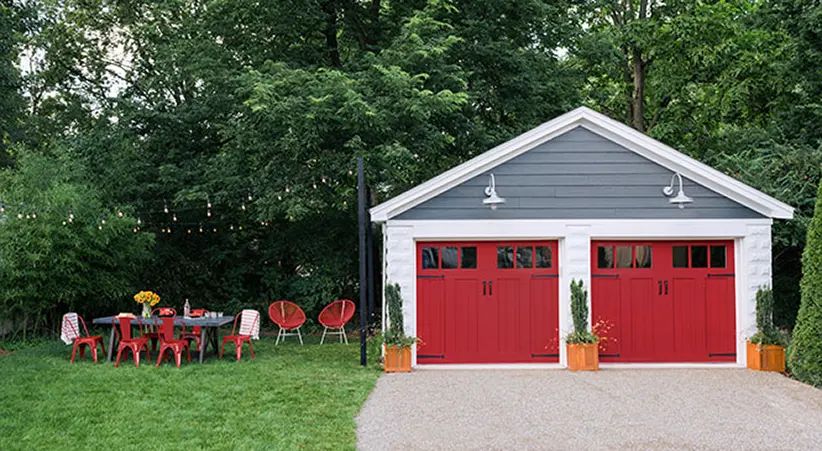 Urban Oasis 2018 home, yard and garage with Clopay garage doors closed