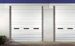 Industrial Series | Deep Ribbed Steel commercial garage door Model 525V in White with windows