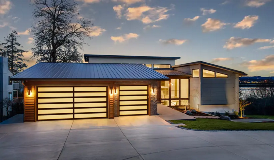 Clopay Avante® Sleek aluminum and glass garage doors on modern home