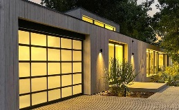 Avante AV | Full View Windows in Frosted Glass in Black Finish glowing at night