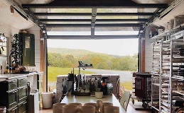 Avante AV | Interior view of open modern garage door on art studio