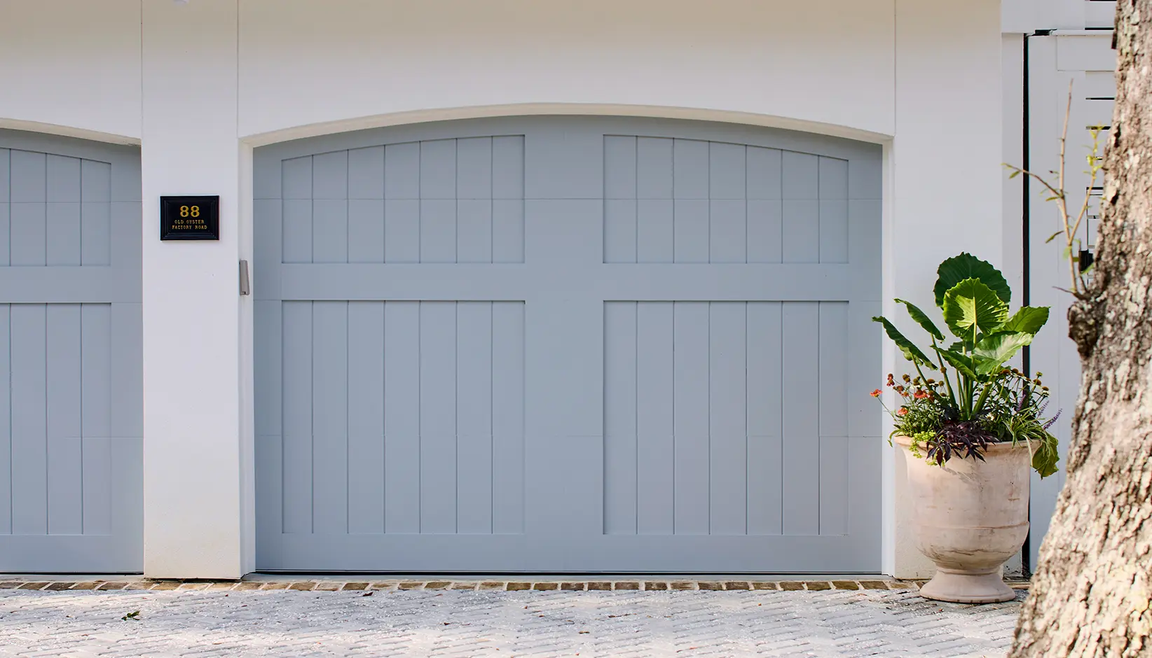 CR5L-D36-Arch1 Canyon Ridge 5-Layer garage door in Design 36 with ARCH1 top Sherwin Williams Uncertain Gray