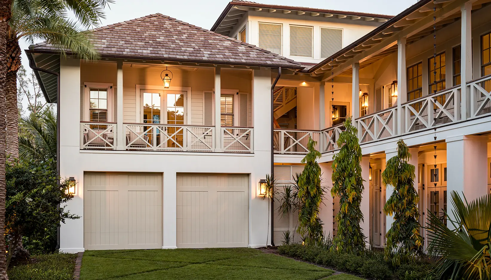 Canyon Ridge® 5-Layer carriage house garage door in Design 11 with TOP11 solid top section in custom color