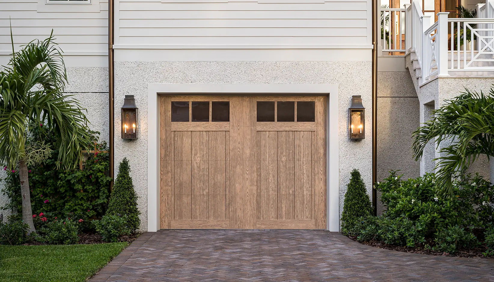 Canyon Ridge® 5-Layer faux wood garage door in Design 11 with REC13 windows in Natural Finish