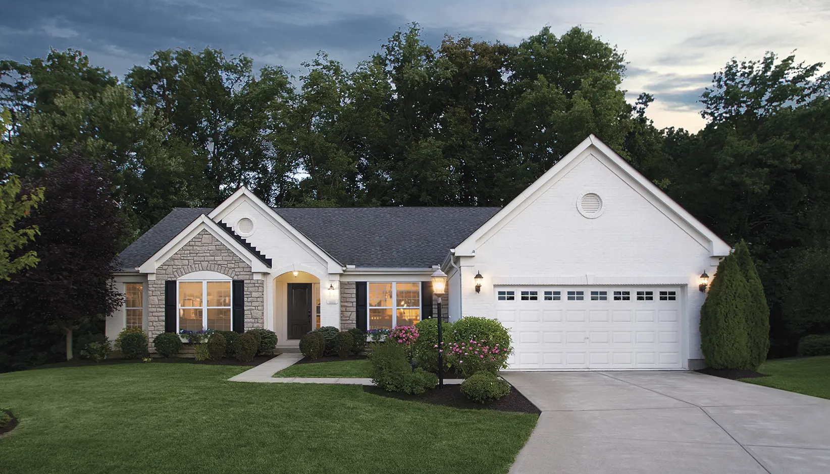 Classic Steel garage door with traditional short panels and Colonial 509 windows in white
